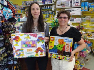 Jessi Wright, left (co-owner with Alan Read) of Big Smiles toy story in Smithers) recently donated two boxes of building blocks to the children of the Child Focus Africa Dormitory for special needs children in Migwani, Kenya. Judy Senka, Child Focus Africa Treasurer is on the right.  These blocks will go to Migwani in august with some trekkers on their way to climb Mt. Klimanjaro with Adventure Africa.  The blocks will be particularly valued since the children have virtually no toys. CFA wishes to thank Jessi and Alan for their generosity.
